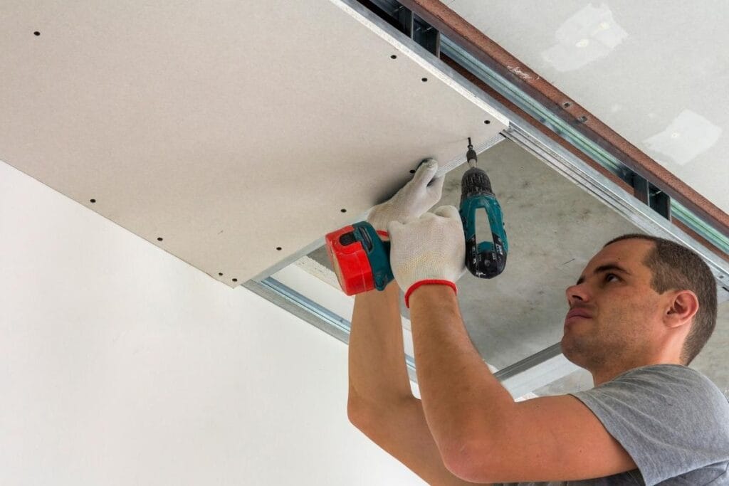 a technical view of a drywall sheet attached to wooden framing